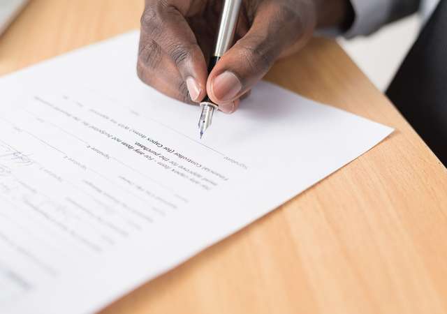 Man signing documents