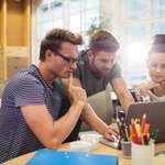 people looking at laptop